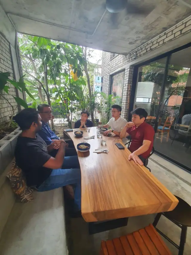 Founders talking around a table at The Dune